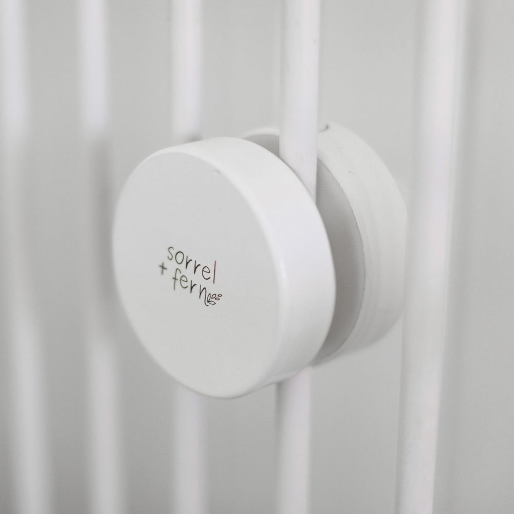 Sorrel and Fern compatible with slatted cribs and flat surfaces for versatile use.