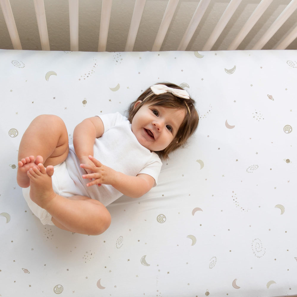 Sorrel+Fern crib sheet elastic band detail demonstrates secure fit.