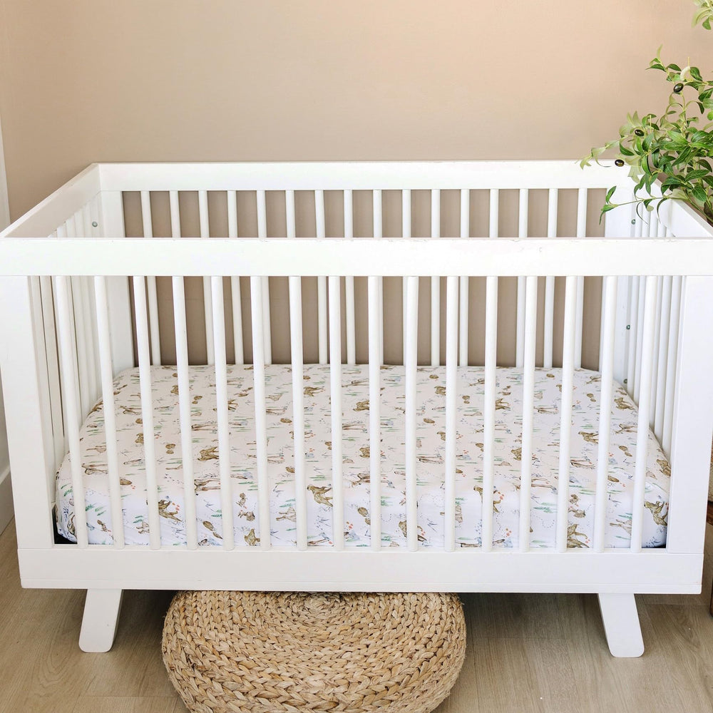 Sorrel + Fern neutral design coordinates with other nursery decor and mobiles.