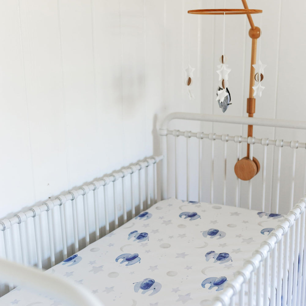 Sorrel + Fern hanging mobile elephant motif adds soothing nursery ambiance.