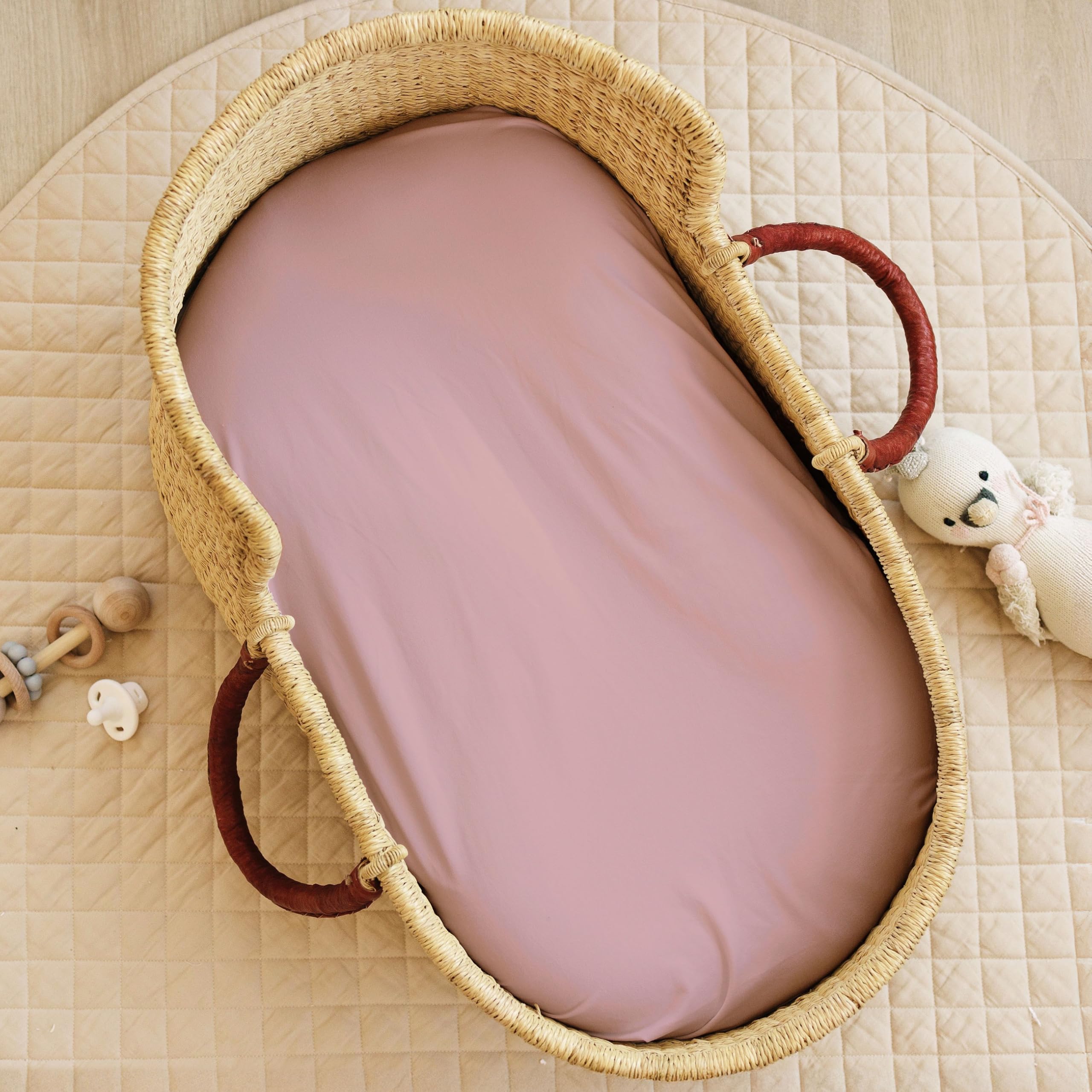 Close-up of deep elastic pockets on Sorrel + Fern bassinet sheets
