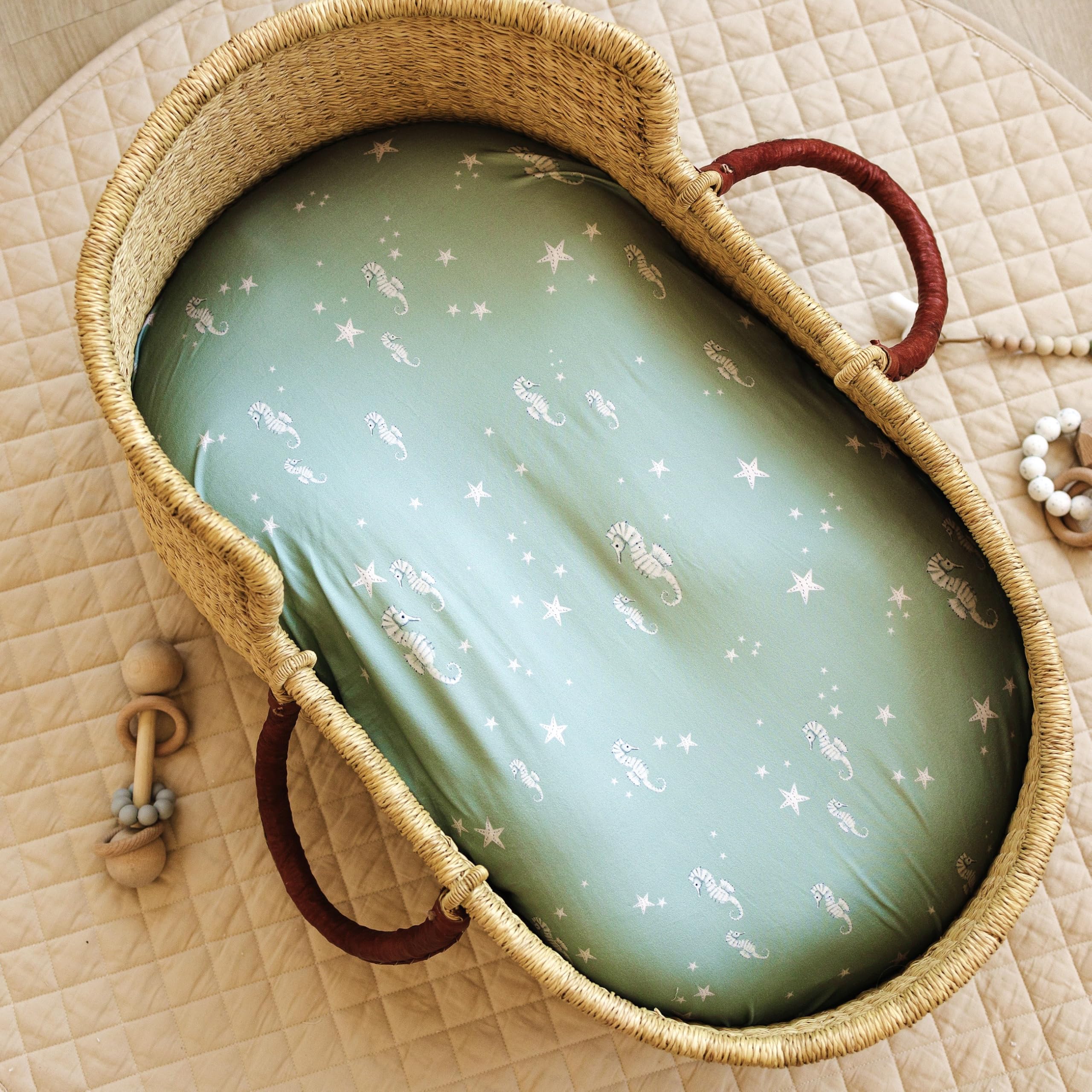 Sorrel + Fern Ocean Odyssey nursery decor hints at coordinating mobiles.