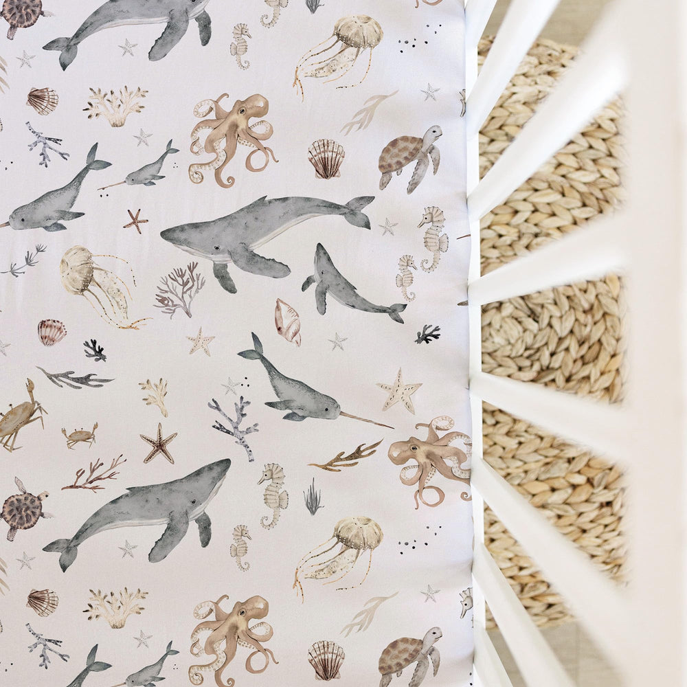 Sorrel + Fern Ocean Odyssey sheet on toddler bed demonstrates durable washability.