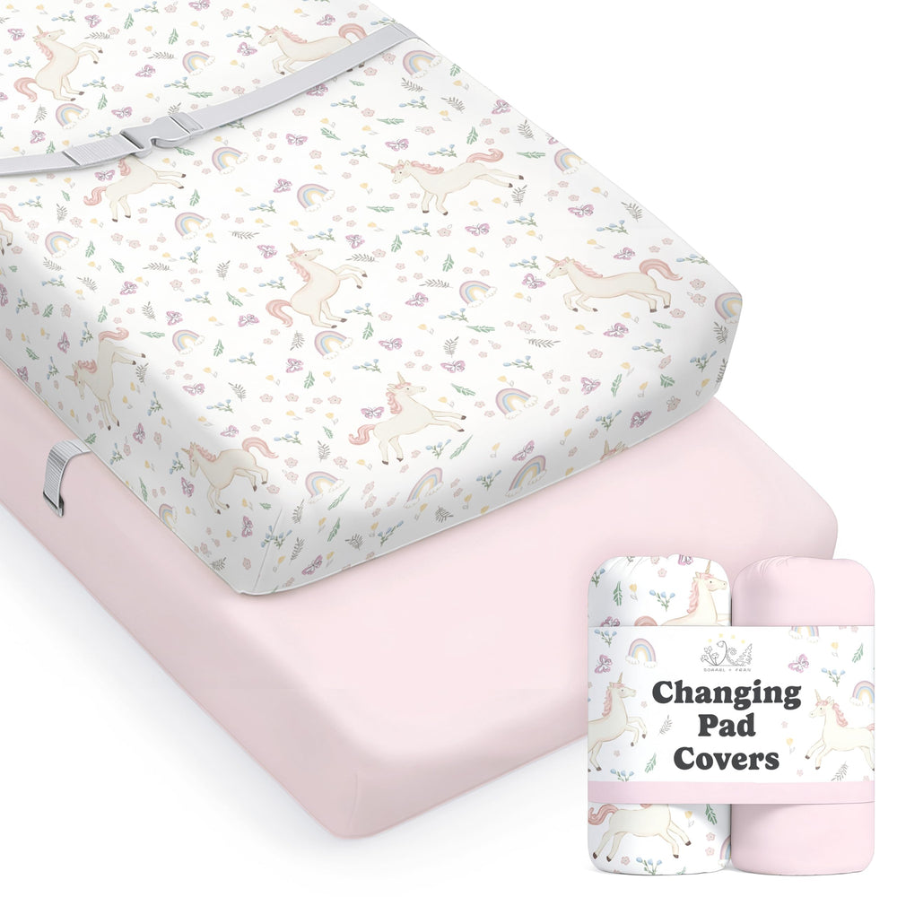 Sorrel + Fern Unicorn Blossom changing pad cover in action, silky cotton blend protects baby during changes.