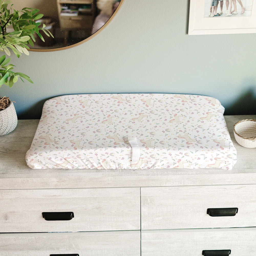 Close-up of soft fabric and deep pockets keep the cover secure on the changing pad.