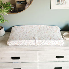 Close-up of soft fabric and deep pockets keep the cover secure on the changing pad.