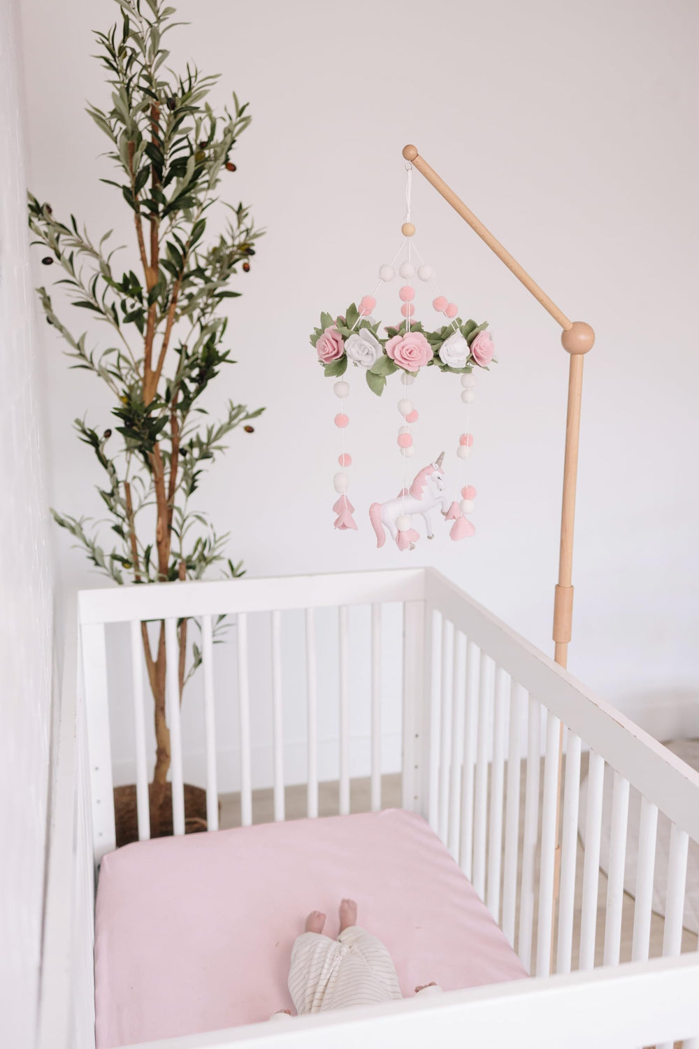 Sorrel + Fern unicorn-blossom-mobile is adjustable to fit crib height.