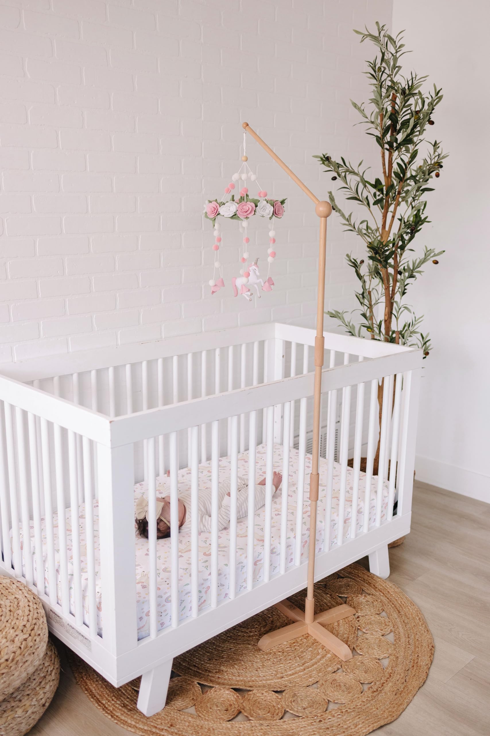 Sorrel + Fern unicorn-blossom-mobile features rose details and pom-poms for cozy ambiance.
