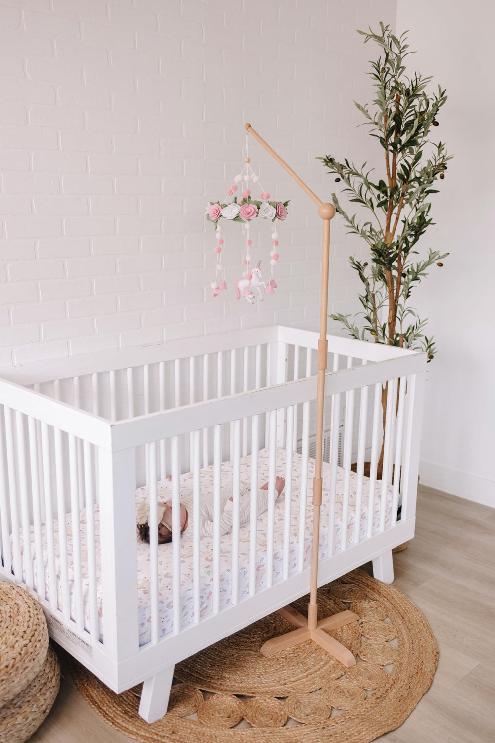 Sorrel + Fern unicorn-blossom-mobile features rose details and pom-poms for cozy ambiance.