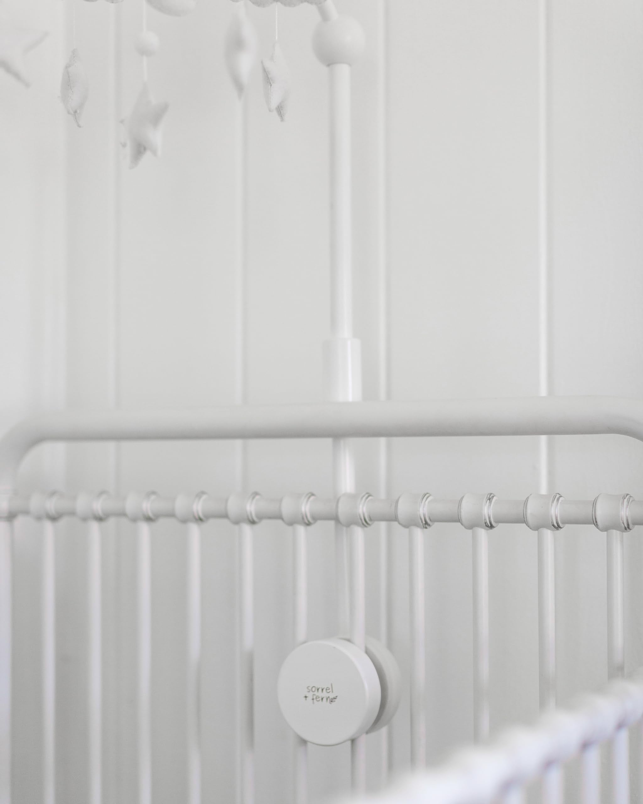 Sorrel and Fern white finish complements modern nursery decor and creates a calm focal point.
