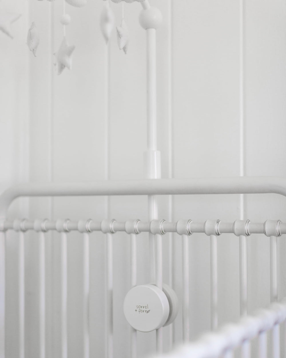 Sorrel and Fern white finish complements modern nursery decor and creates a calm focal point.