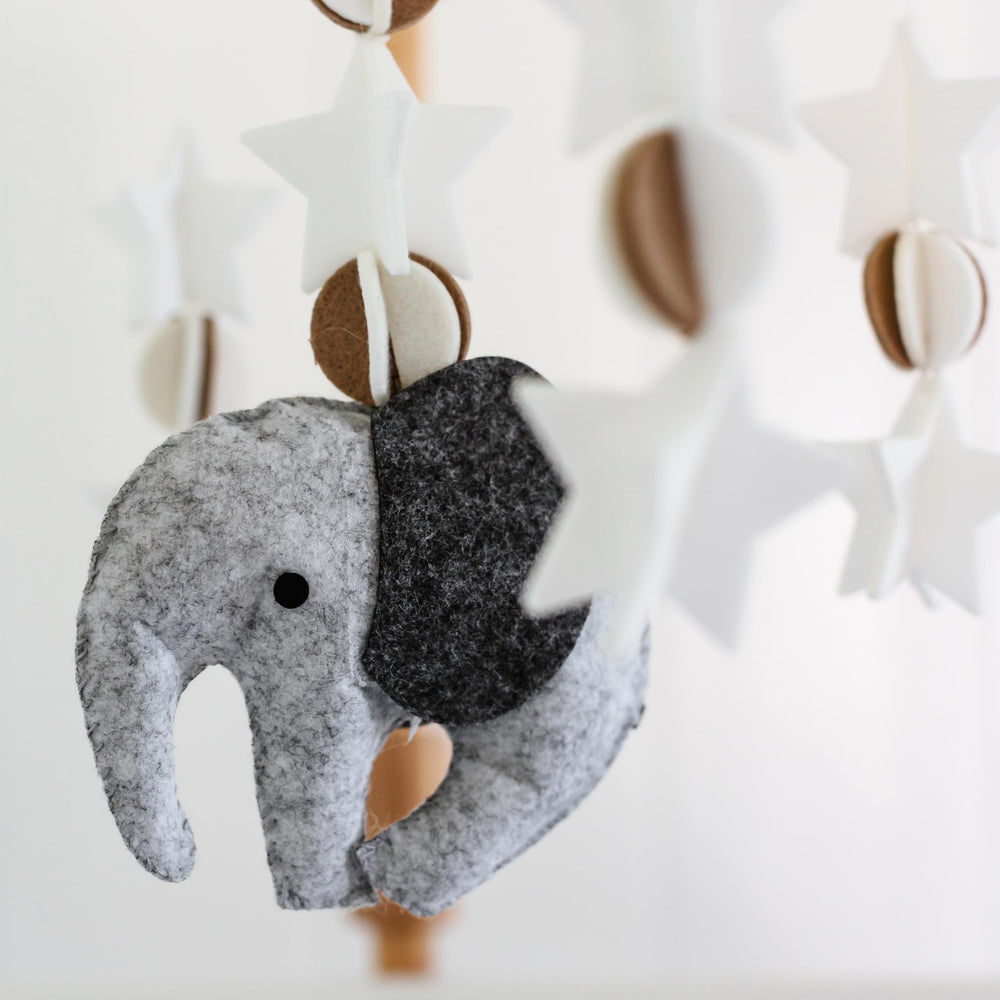 Sorrel + Fern wooden mobile for nurseries enhances visual interest above the bassinet.