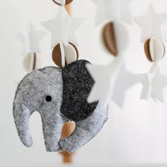 Sorrel + Fern wooden mobile for nurseries enhances visual interest above the bassinet.