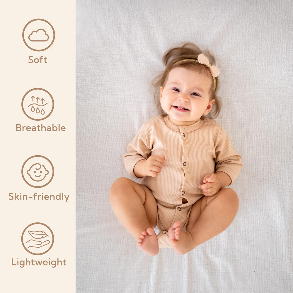 SOULFUL crib-sheets closeup softness emphasizes gentle touch on baby skin