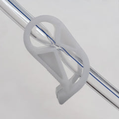 SoulGenie HealthAndYoga enema clamp close-up showing pinch mechanism for precision.
