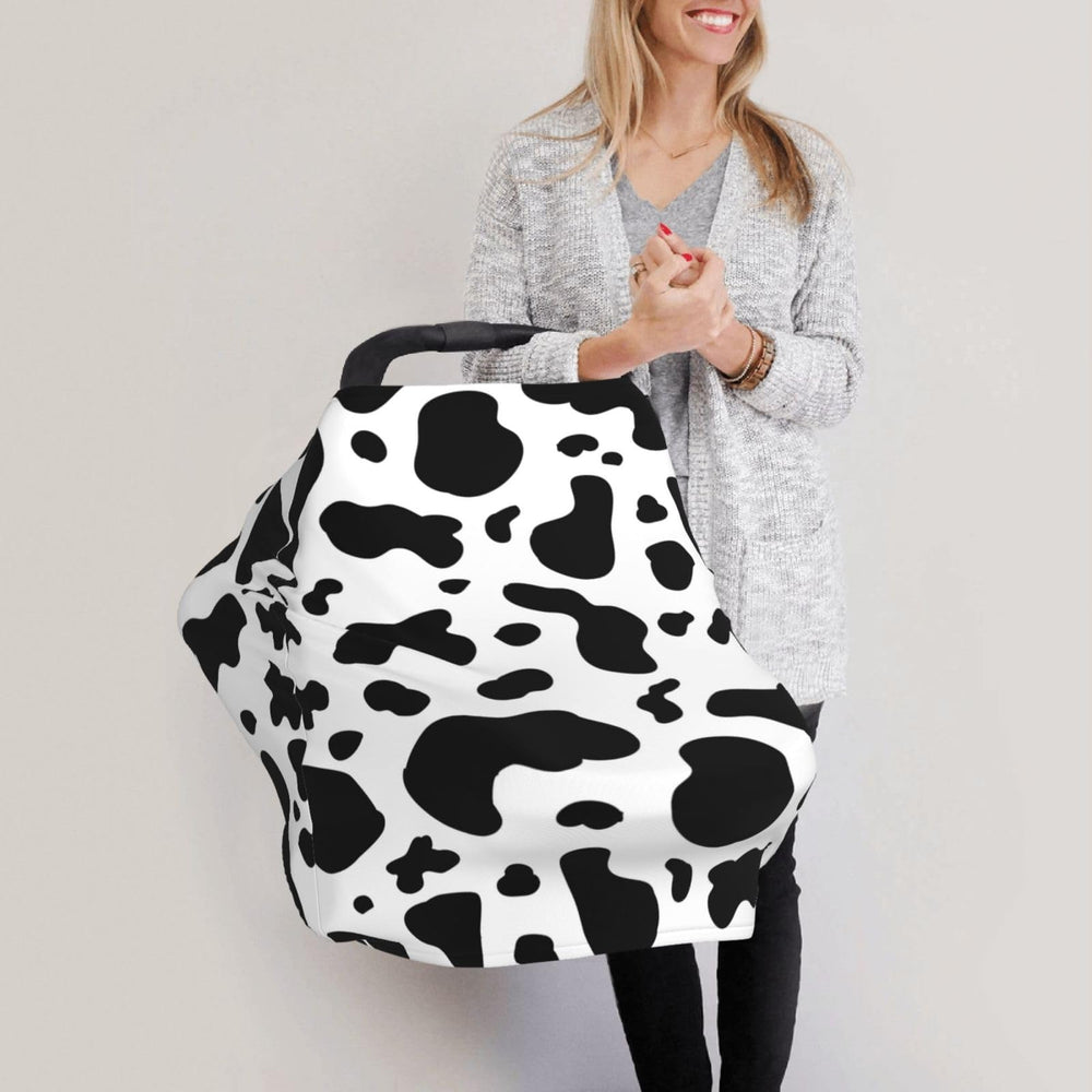 Sozzjile cow print shopping cart cover creates a clean, soft space.