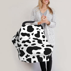 Sozzjile cow print shopping cart cover creates a clean, soft space.