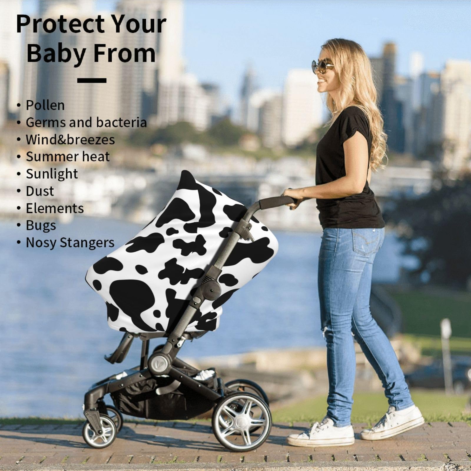 Sozzjile cow print stroller cover doubles as a nursing shield.
