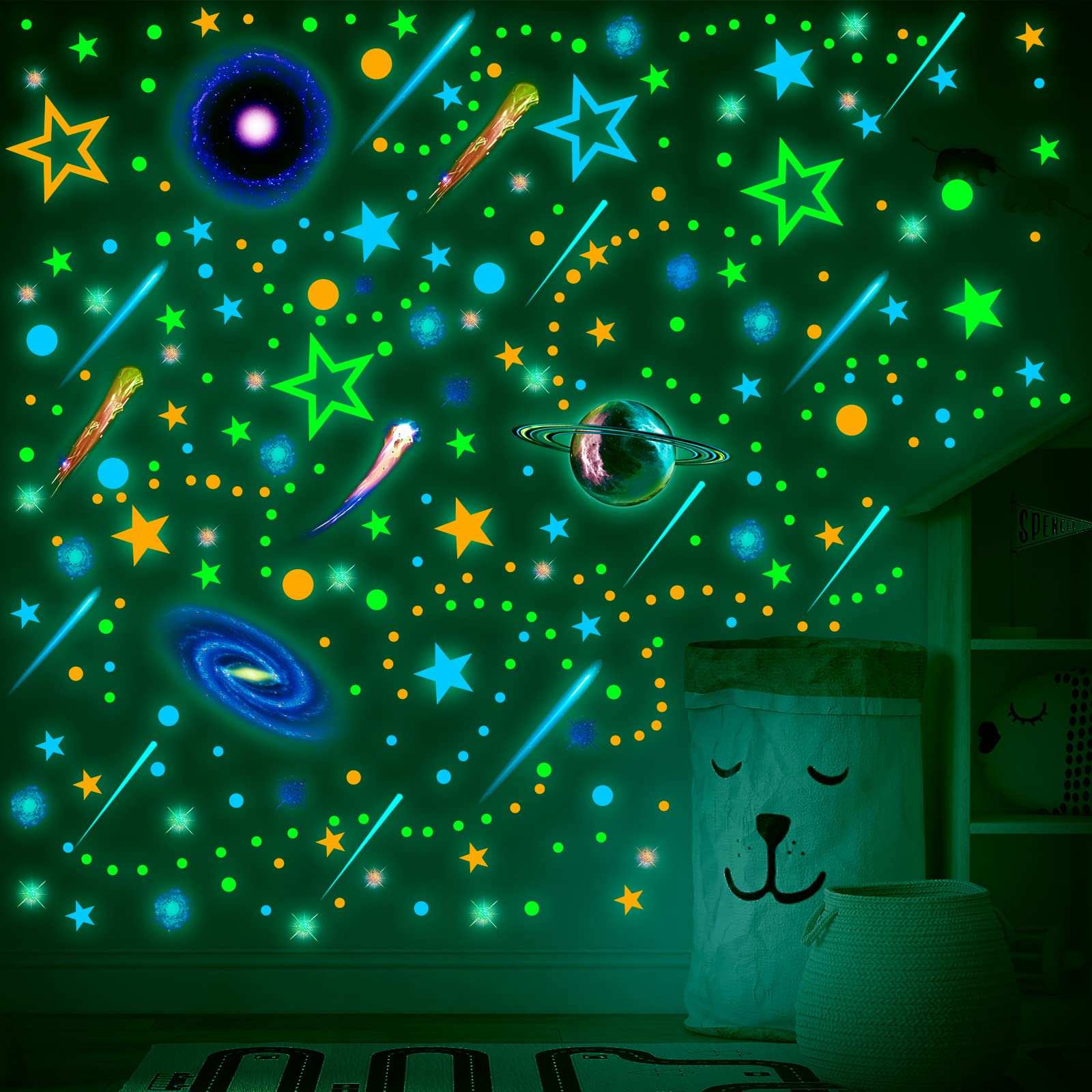 Spakon blue, green, pink, black, and yellow hues glow softly at night