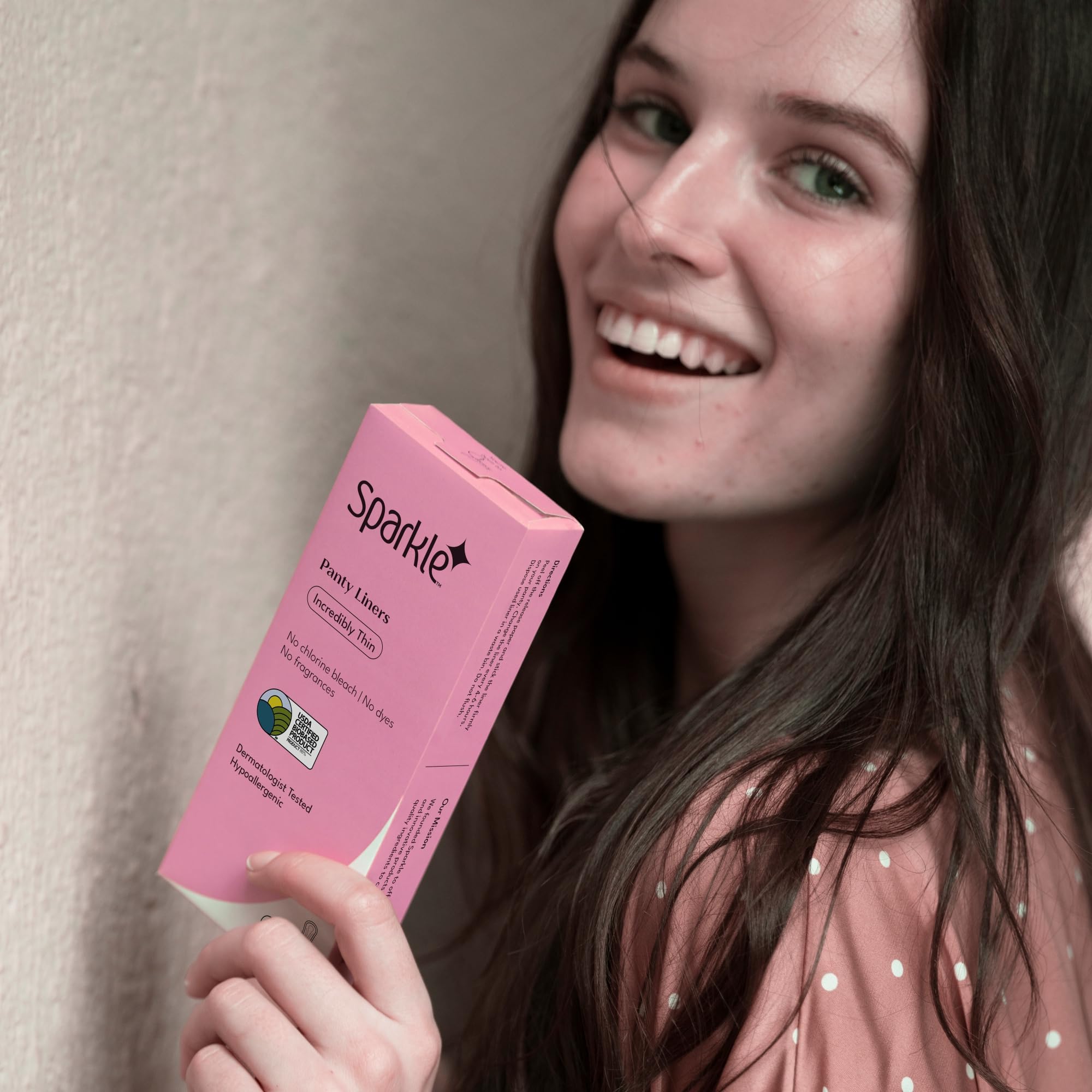 Sparkle panty liner featuring wider back and rapid fluid distribution for staying dry.