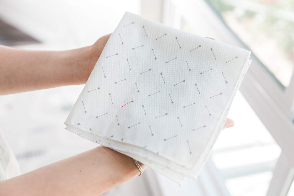 Spilt Milk Pink Arrow packaging highlights reusable baby cloths for on the go