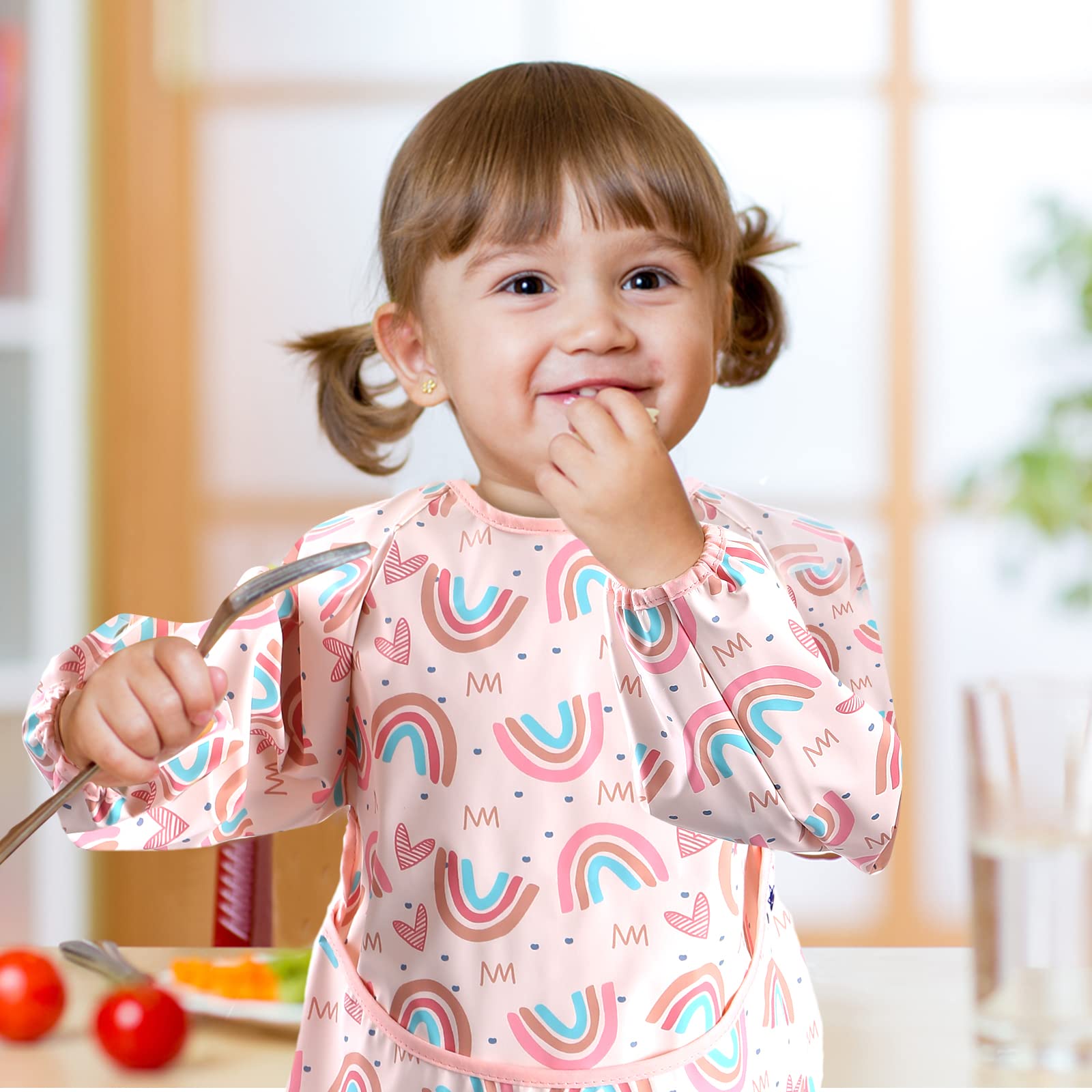 SPINFOX food catcher pocket on baby smock helps contain messes