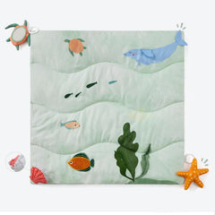Spirich 9-in-1 tummy time mat closeup highlights the soft surface for gentle play.