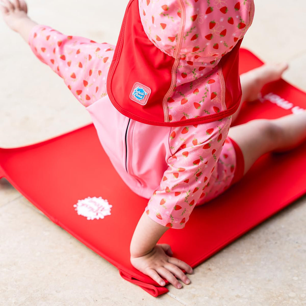 Splash About Baby Neoprene Changing Mat Red shown with transport bag for travel