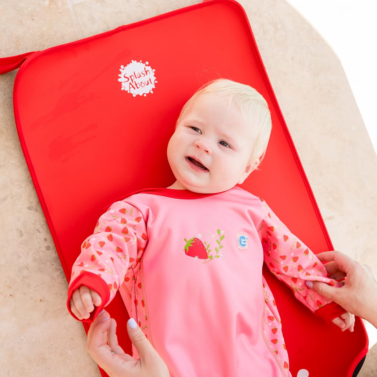 Splash About Baby Neoprene Changing Mat Red folded for travel and easy packing