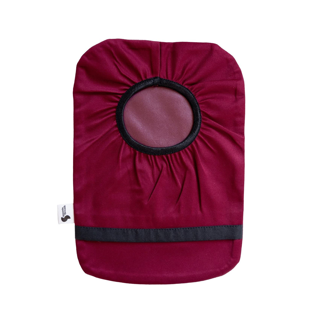 Spoonie Threads burgundy elastic ostomy bag cover close-up showing secure adjustable fit.