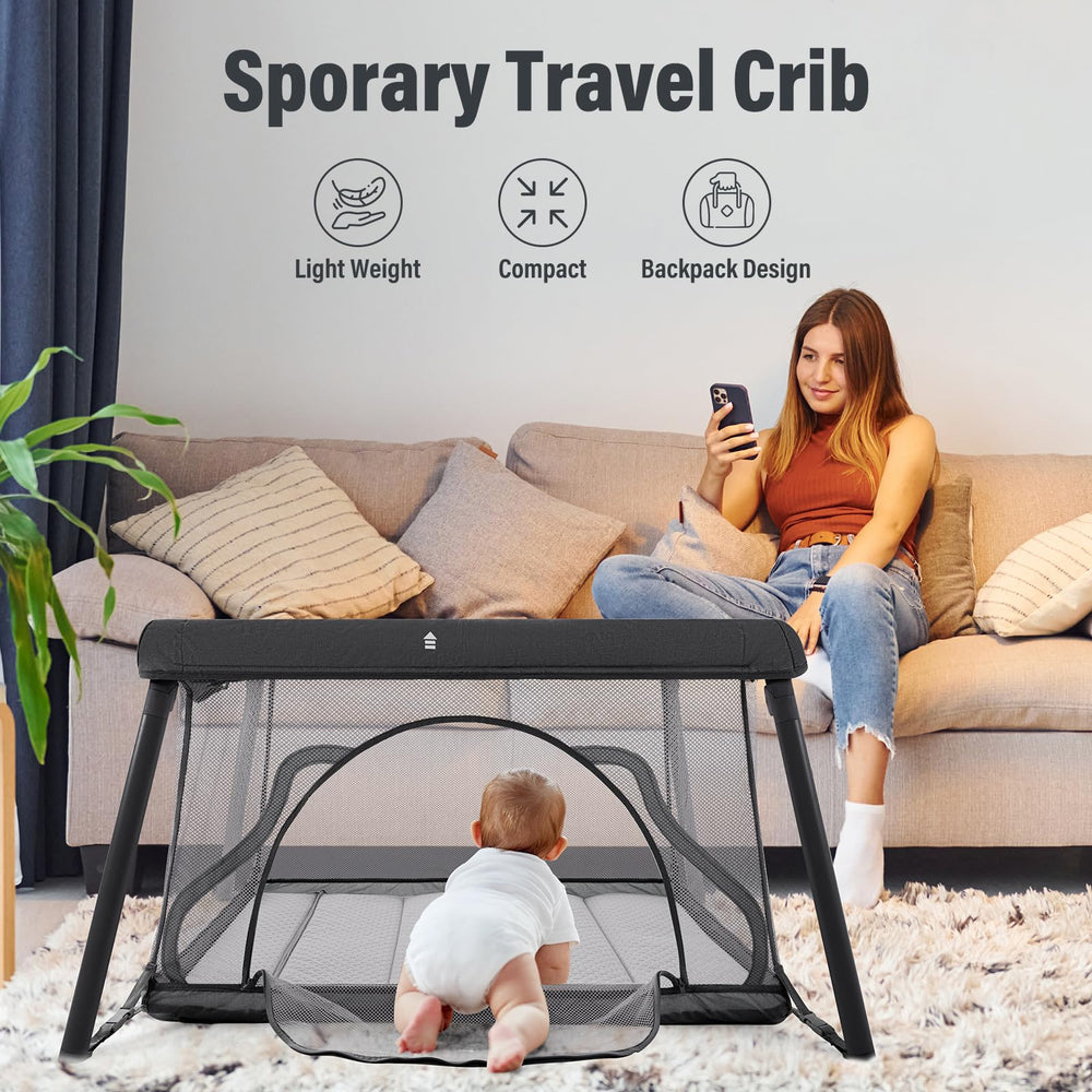 Sporary Travel Crib open playpen ready for floor play.