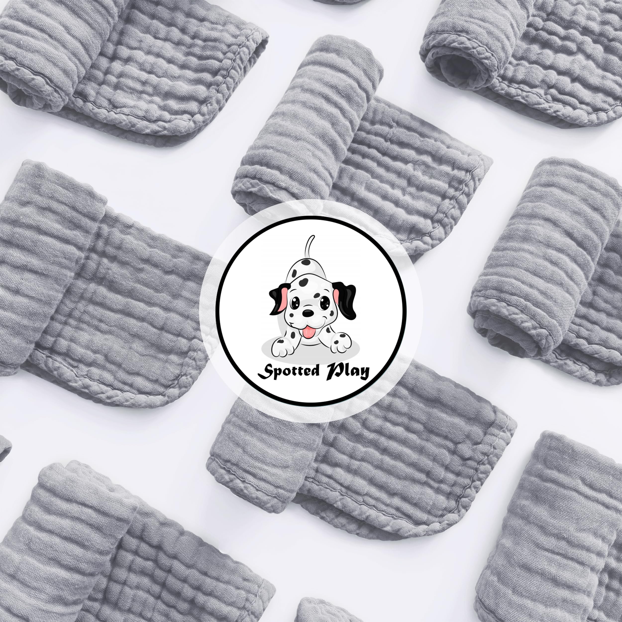 Spotted Play grey muslin burp cloth with reinforced edges and high absorbency.