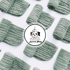 Spotted Play muslin cotton burp cloths pack of 12 laid flat for versatility.