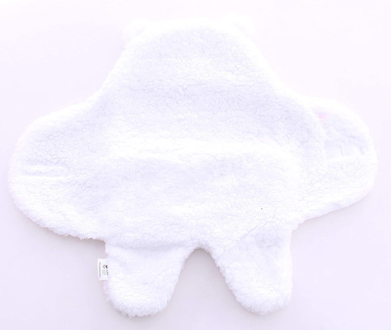 Baby wearing the Spotted Play sherpa swaddle for snug comfort