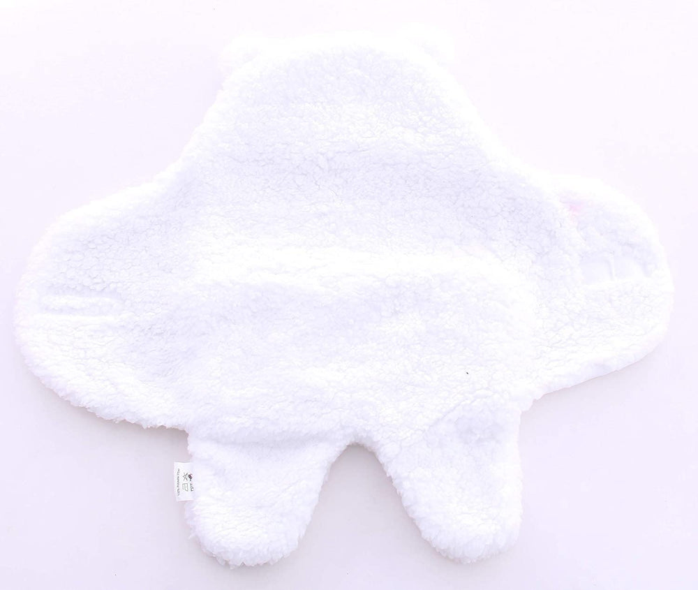 Baby wearing the Spotted Play sherpa swaddle for snug comfort
