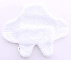 Baby wearing the Spotted Play sherpa swaddle for snug comfort