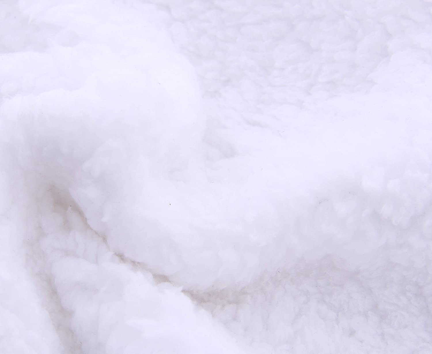 Spotted Play sherpa swaddle as crib wrap in nursery