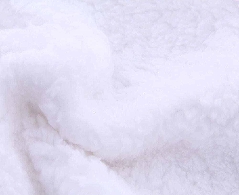 Spotted Play sherpa swaddle as crib wrap in nursery
