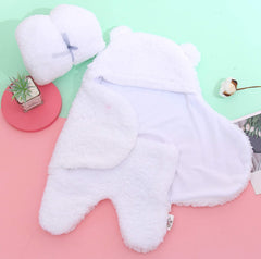 Bear hoodie detail on Spotted Play sherpa swaddle blanket