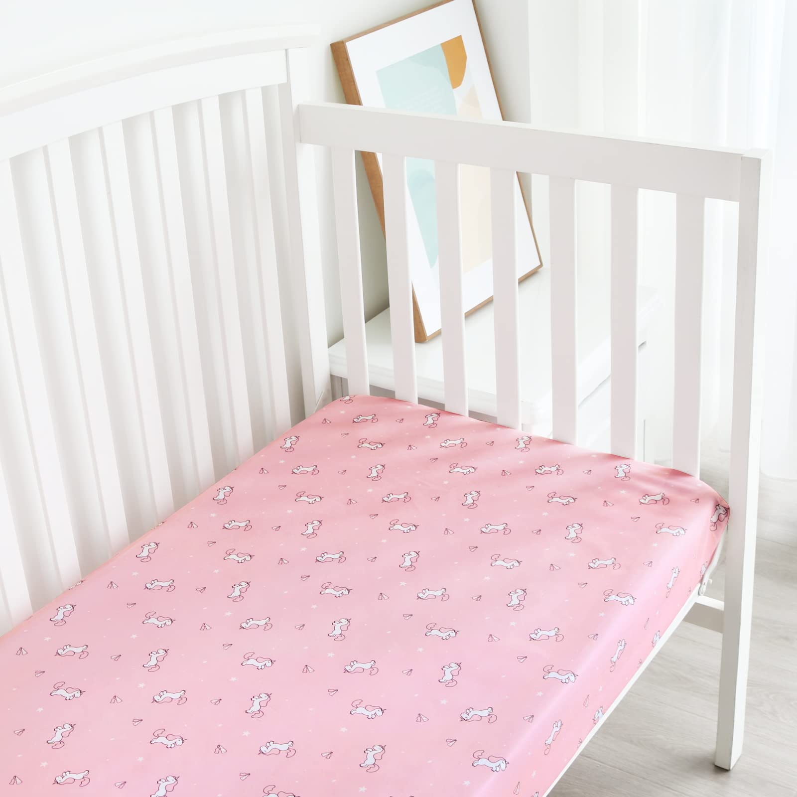 SPRINGSPIRIT girl crib sheets adds soft, neutral and pink tones to nursery decor.