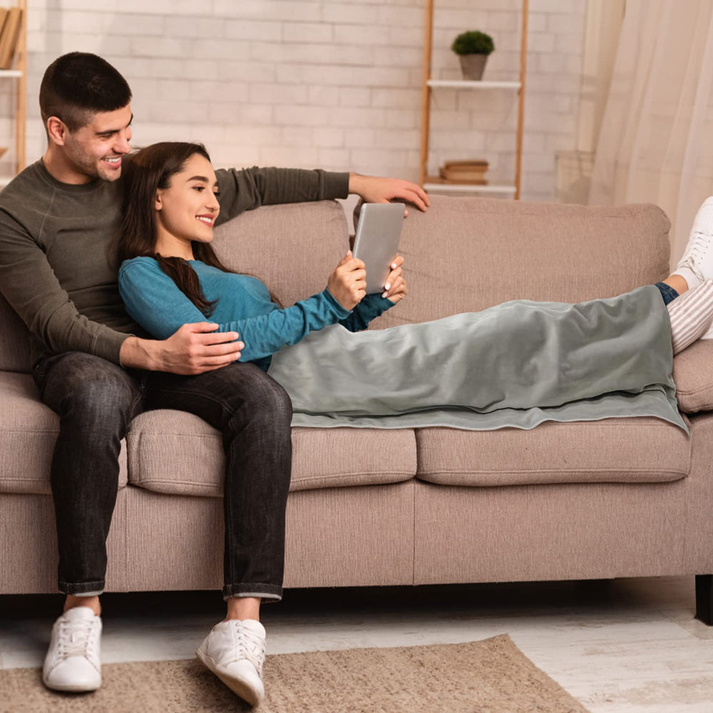 STARLENGET EMF blanket laid over lap for tablet use