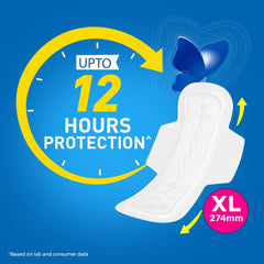 Stayfree pad with wings resting beside a clock for overnight protection