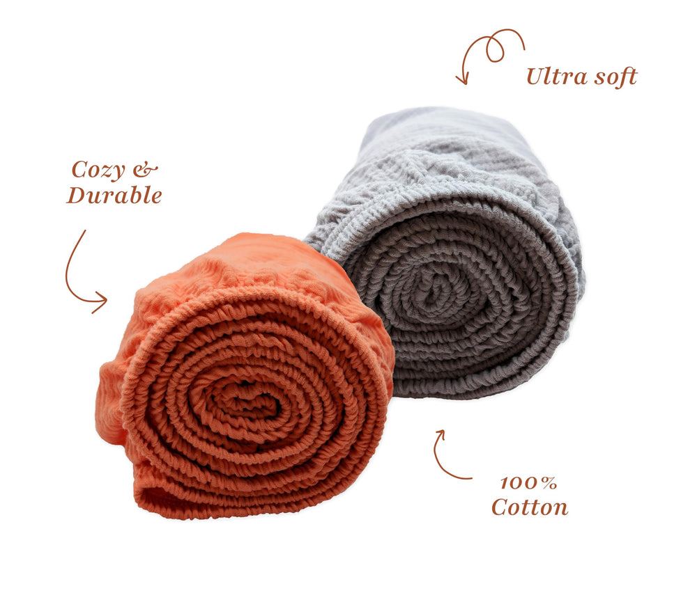 Close-up of Stellar Kiddos muslin texture, highlighting softness and airiness against delicate skin.