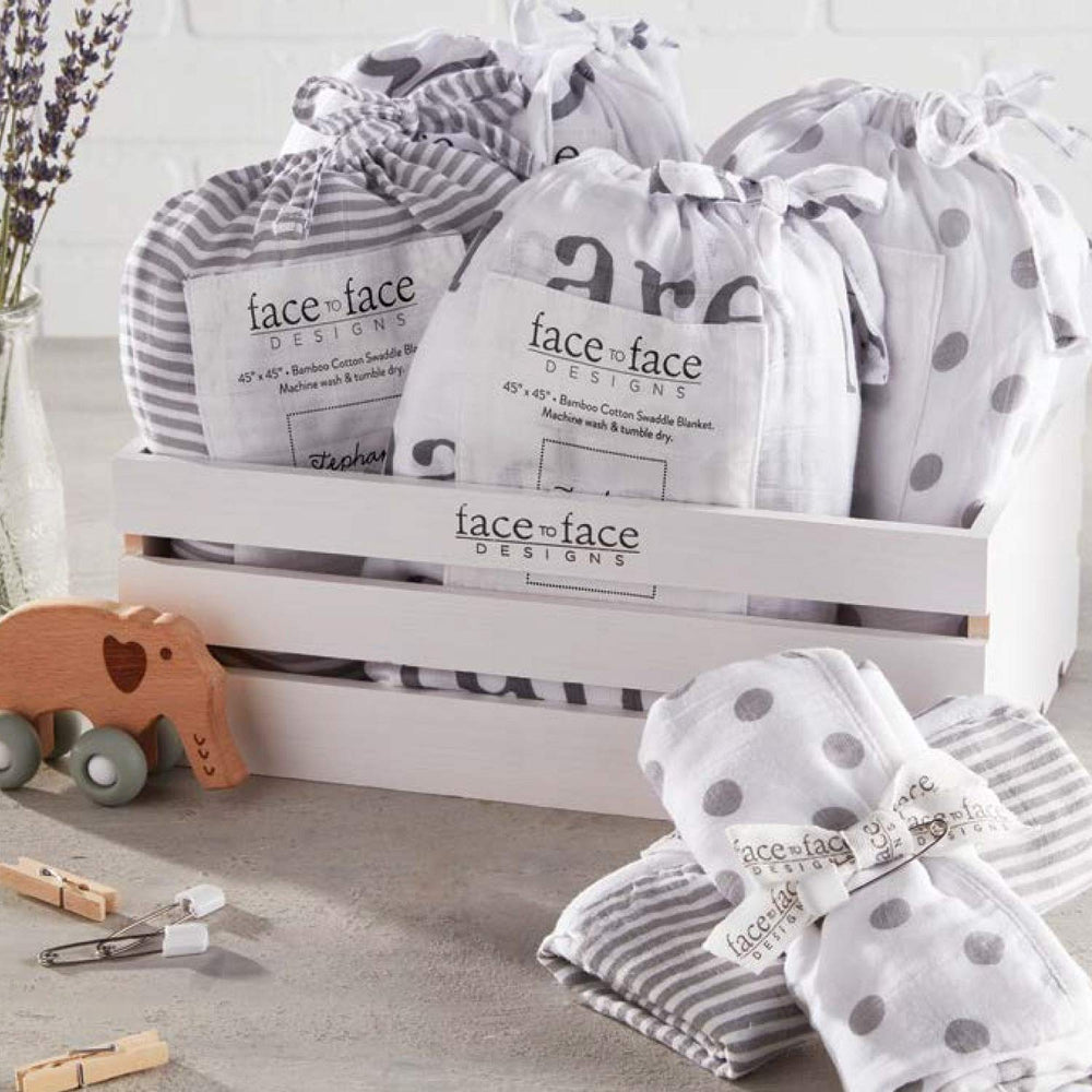 Gender-neutral Stephan Baby swaddle in gray and white tones for both boys and girls