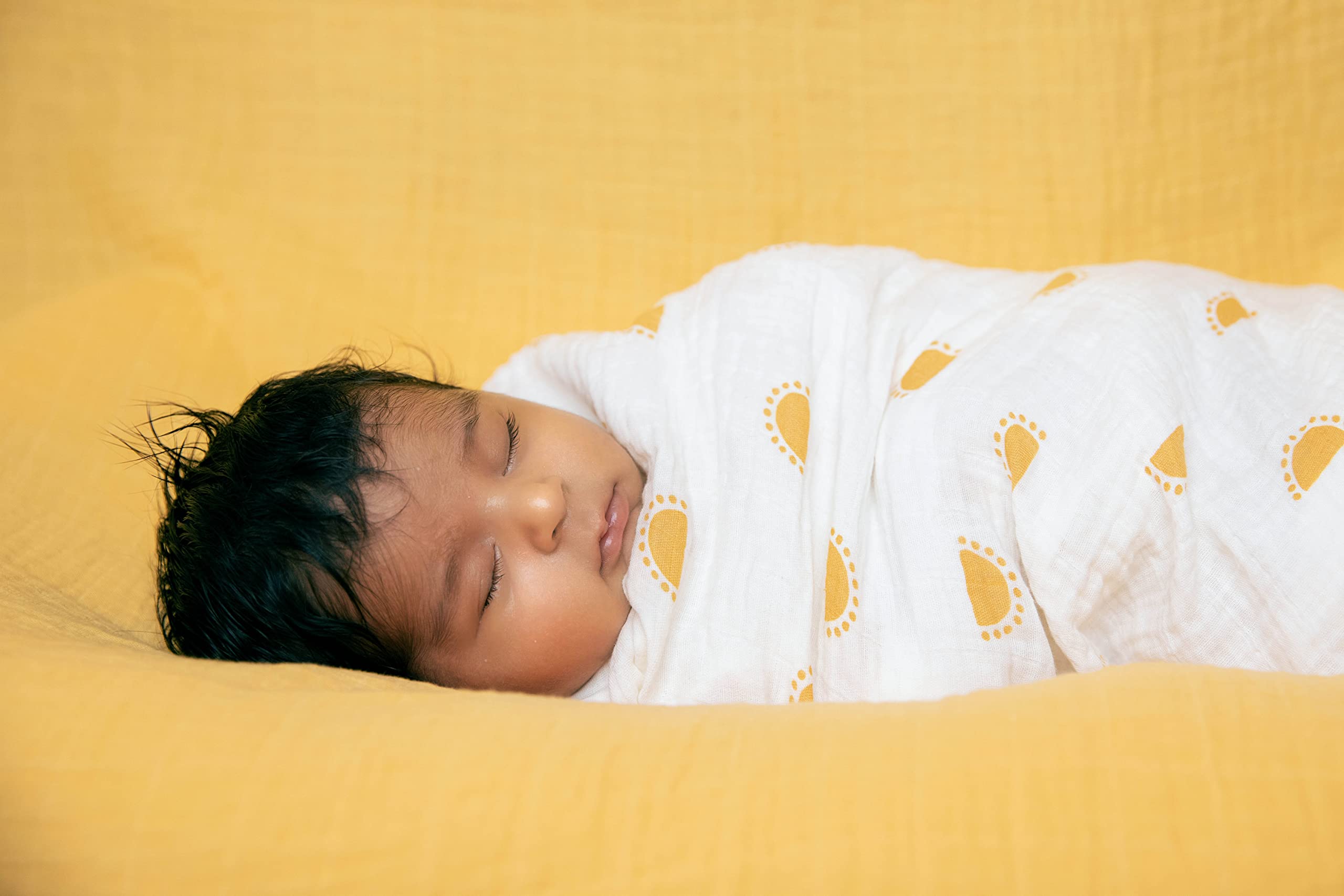 Sticky Toffee Muslin Swaddle 47x47 laid flat showing generous size.
