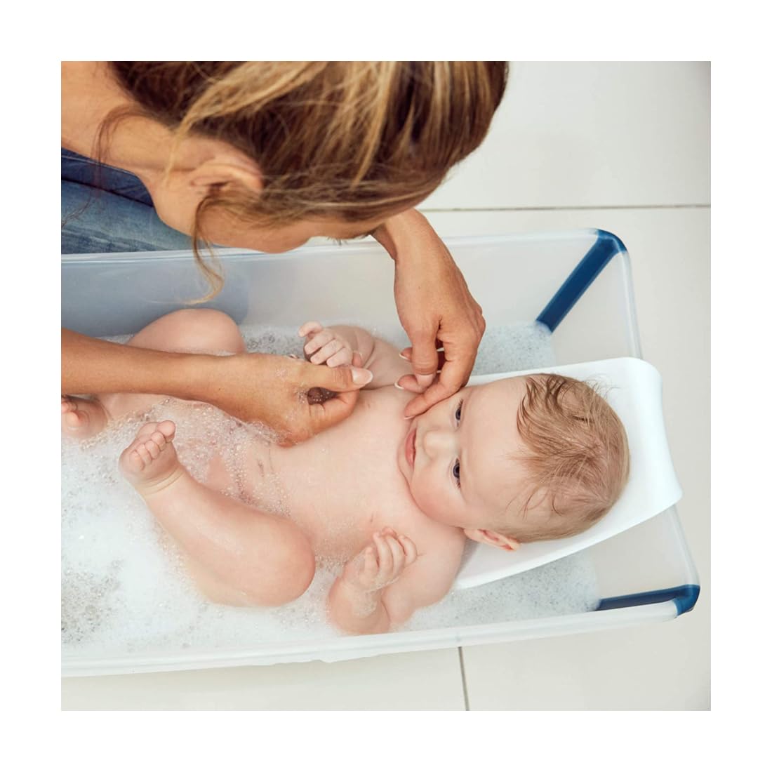 Ergonomic design emphasizes cradle-like positioning for infant comfort
