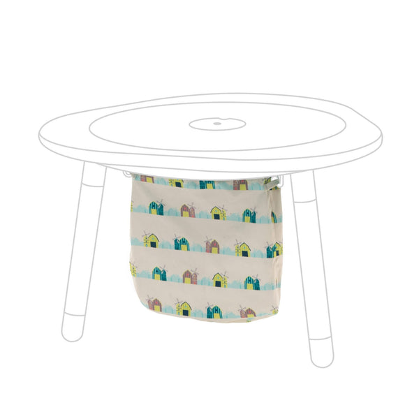 Stokke MuTable cotton bag with windmills keeps toys organized and play area tidy.