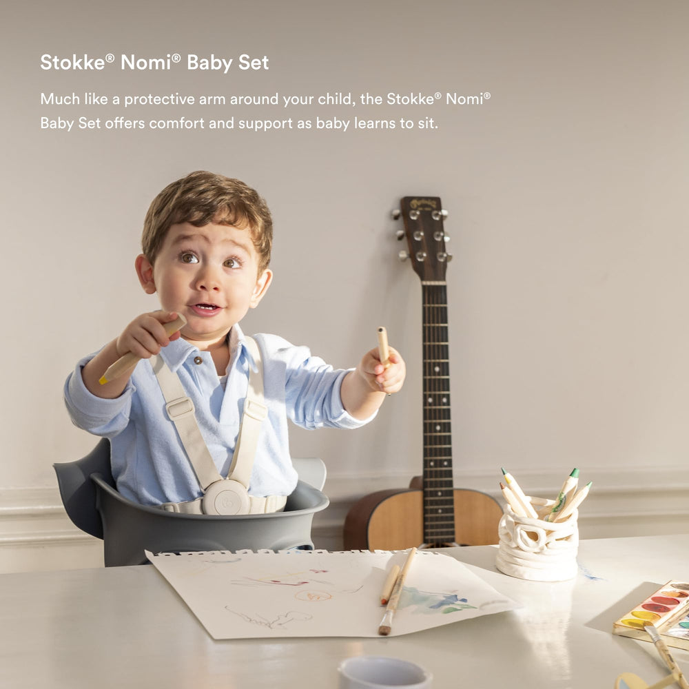 Stokke Nomi chair at table with family during mealtime