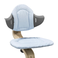 Stokke Nomi Cushion Grey Blue attached to chair for added comfort and fit