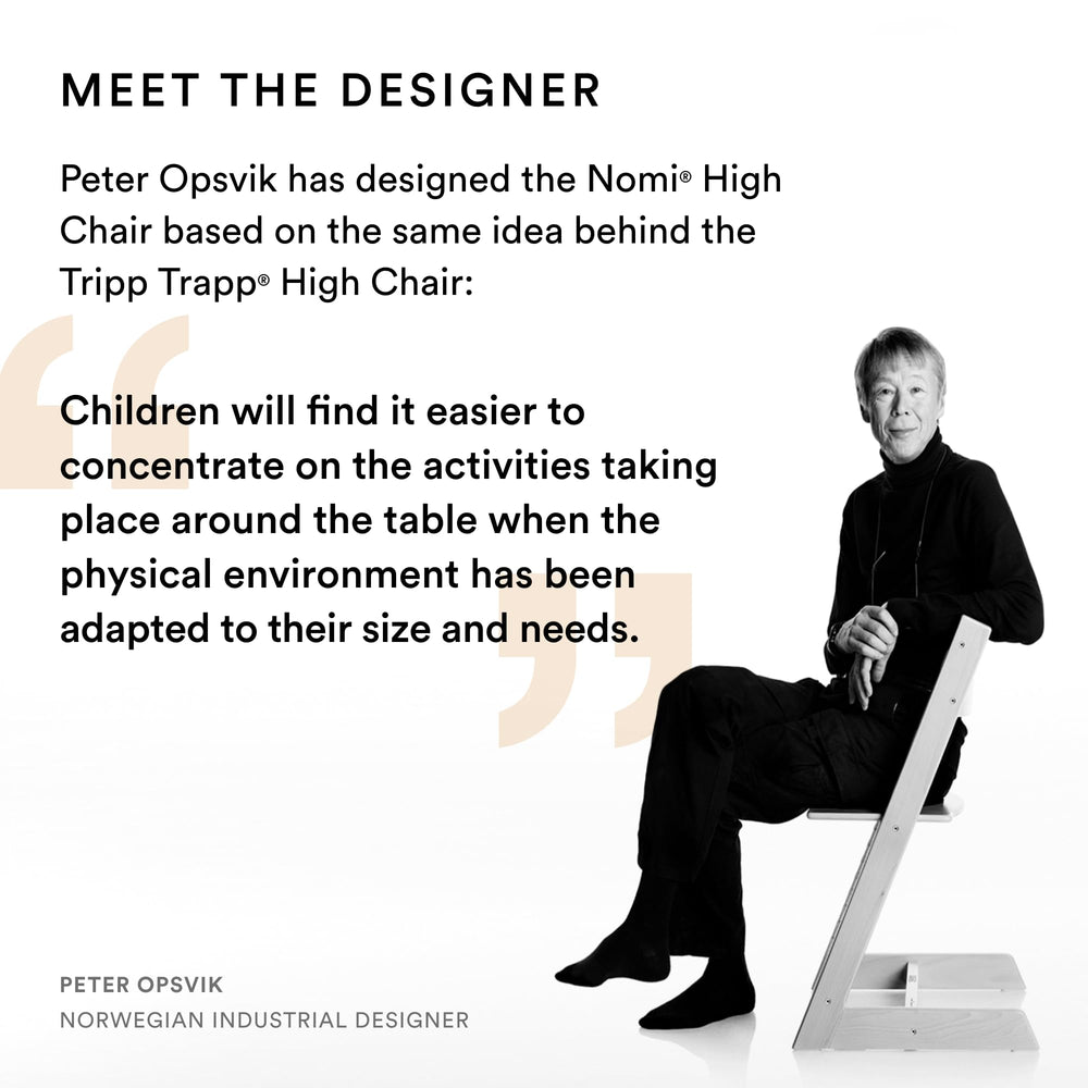 Stokke Nomi easy-clean design hung on table edge after meals